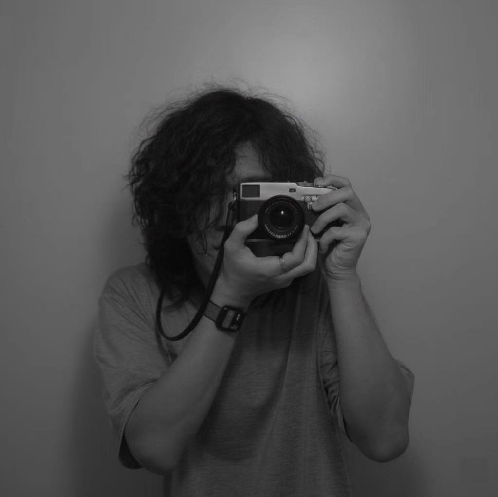 Haosen holding a camera